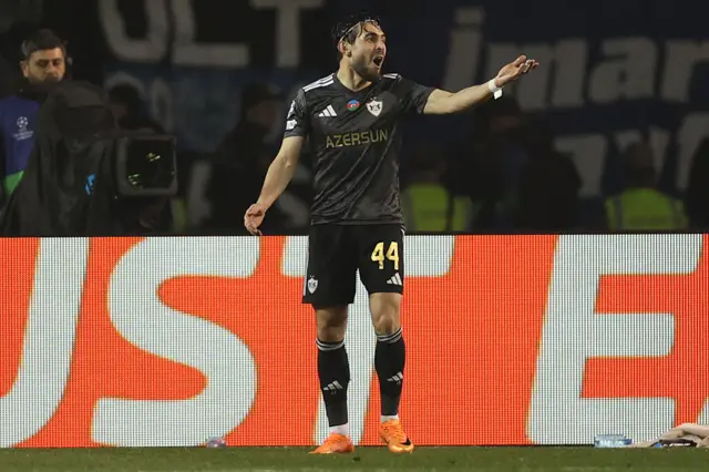 Qarabag's Azerbaijan defender #44 Elvin Cafarguliyev celebrates after scoring the team's first goal