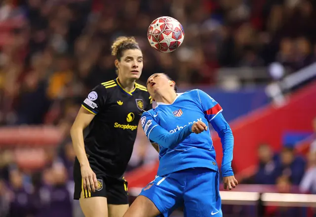 Fiamma tries to head the ball as Janssen watches on