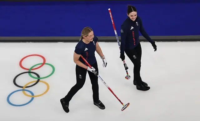 Sophie Sinclair and Rebecca Morrison of Team Great Britain react
