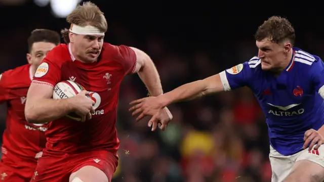 Aaron Wainwright carries the ball for Wales against France