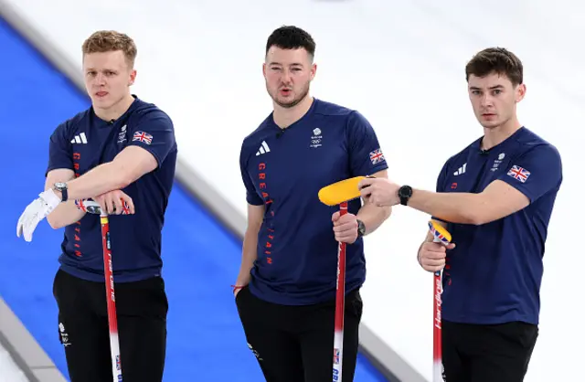 Bobby Lammie, Hammy McMillan and Grant Hardie of Team Great Britain (L-R) react