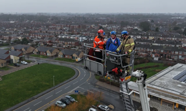 Maurice on an aerial platform at a fire station.