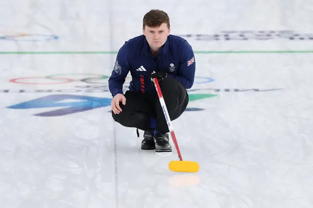Bruce Mouat of Team Great Britain looks on