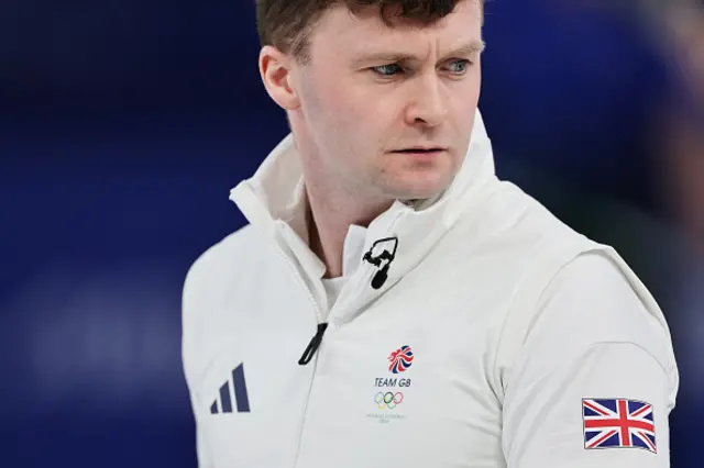 Bruce Mouat of Team Great Britain looks on