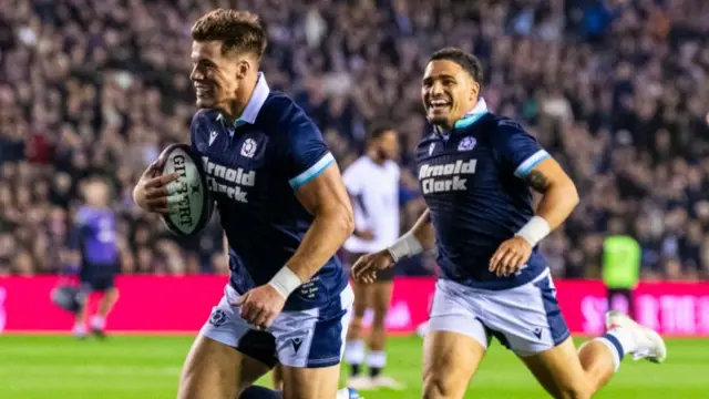 Huw Jones scores a try for Scotland with Sione Tuipulotu in support