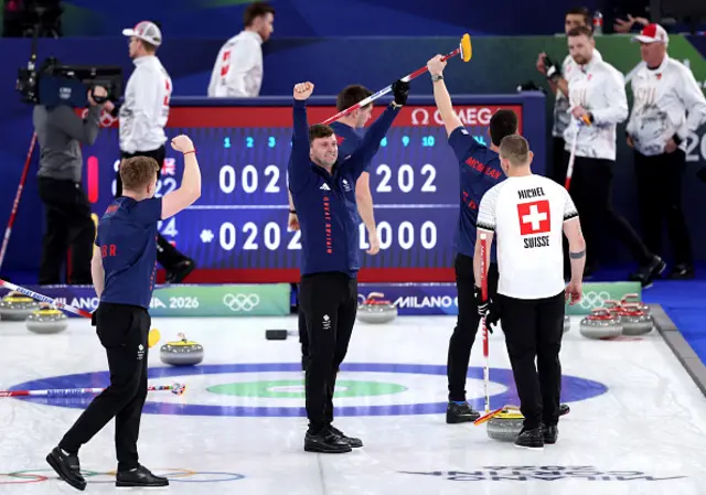 Grant Hardie, Hammy McMillan, Bruce Mouat and Bobby Lammie of Team Great Britain celebrate victory i