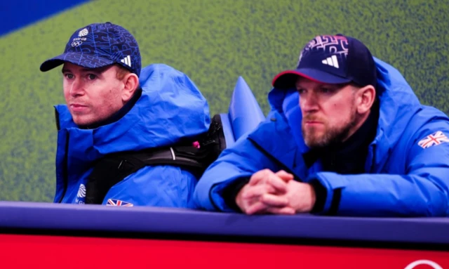 Great Britain National Coach Greg Drummond and Coach Ross Paterson watches the Women's Curling match