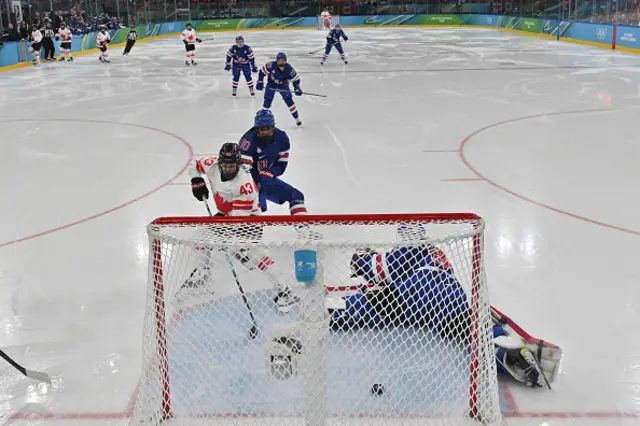 Kristin O'Neill of Team Canada scores the opening goal