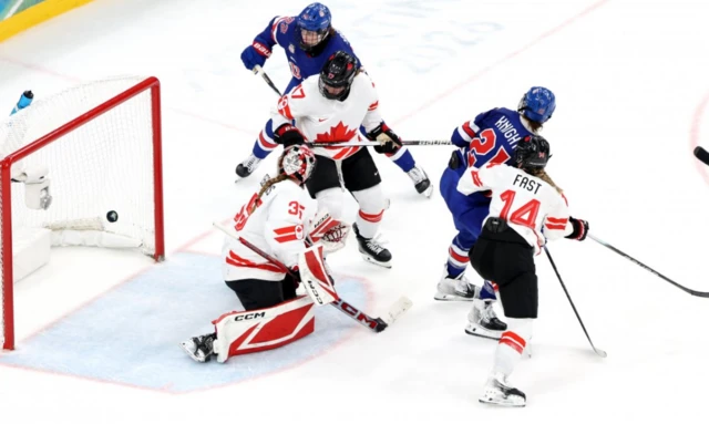 Hilary Knight of USA scores the 1-1 during the Women's Ice Hockey gold medal match