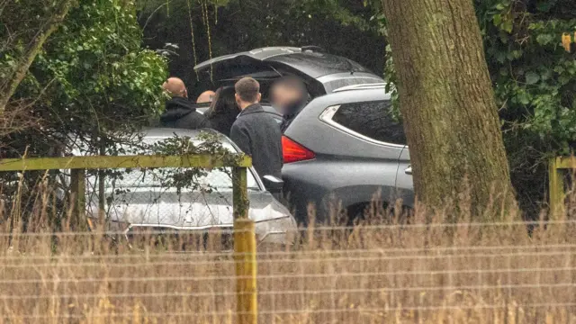 Police by a car on the Sandringham Estate in Norfolk