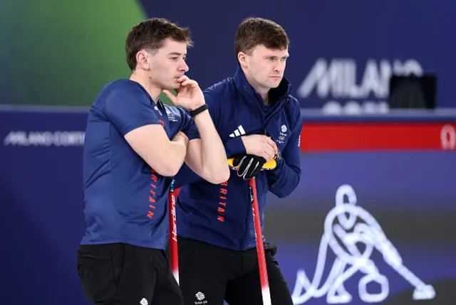 Grant Hardie and Bruce Mouat of Team Great Britain look on