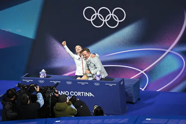 USA's Amber Glenn (L) reacts in the kiss and cry area after competing in the figure skating women's single free skating final