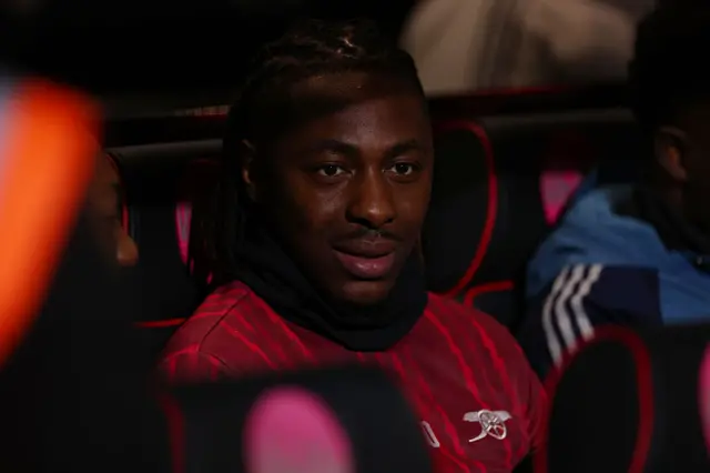 Eze sits on the bench at Bournemouth