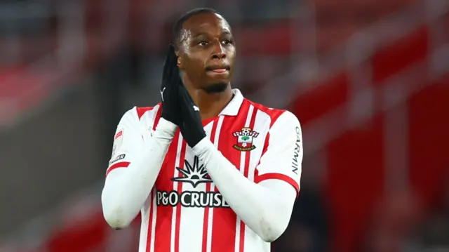 Joe Aribo applauding supporters at the end of a Southampton match
