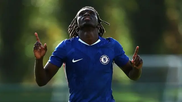 Ato Ampah pointing to the sky