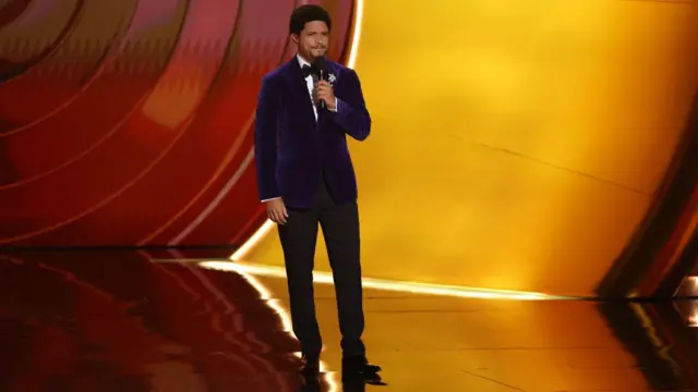 Trevor Noah speaks on stage during the Grammy's