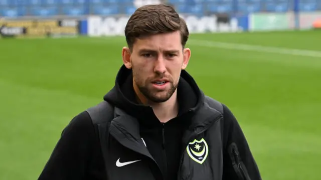 Callum Lang arriving for a game at Fratton Park during his time with Portsmouth