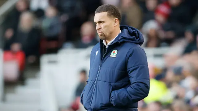 Valerien Ismael stands on the touchline with his hands in the pockets of his Blackburn Rovers jacket