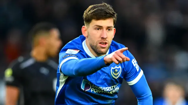 Portsmouth striker Callum Lang celebrates a goal