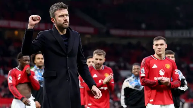 Michael Carrick salutes the Old Trafford crowd after Manchester United's victory over Fulham