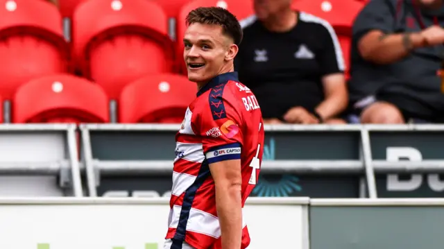 Doncaster's Owen Bailey celebrating scoring against Rotherham earlier this season