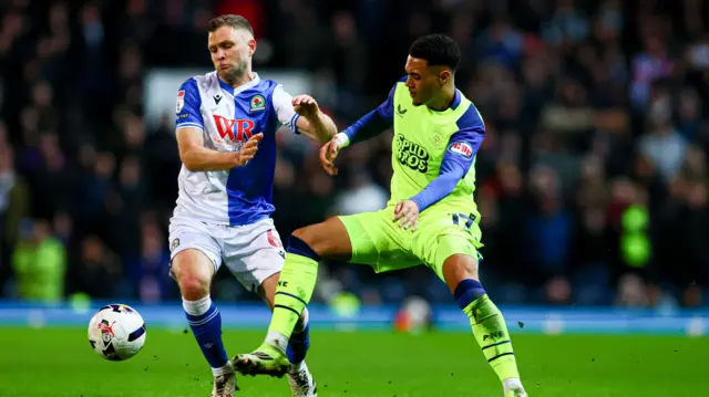 Blackburn's Sondre Trondstad and Preston's Lewis Dobbin challenge for the ball