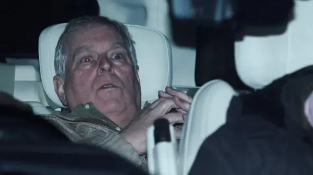 Andrew Mountbatten-Windsor is spotted reclining in the backseat of a Range Rover with his hands clasped