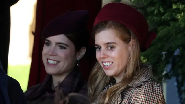 Princesses Beatrice and Eugenie sit side by side