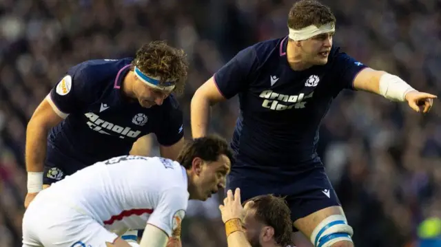 Scott Cummings points to the right during the game against England