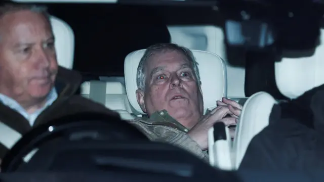 Andrew pictured leaning back in car