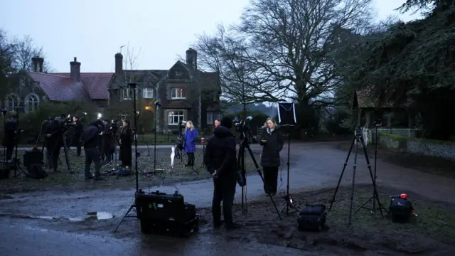 Media teams gather outside Sandringham with cameras and equipment