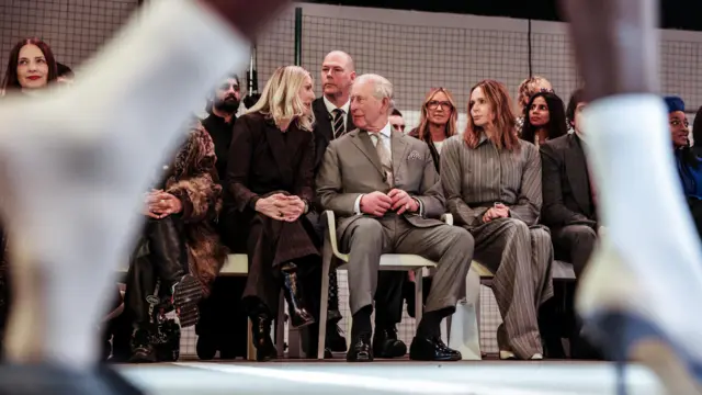 King Charles sits on front row of LFW catwalk