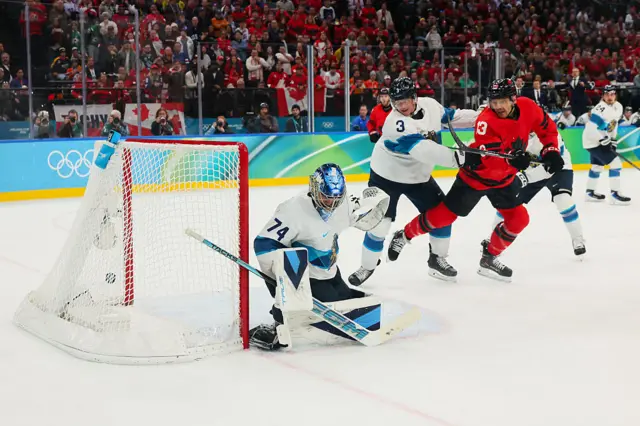 Juuse Saros #74 of Team Finland gives up a goal to Nathan MacKinnon #29 (not pictured) of Team Canada in the third period during the Men's Semifinals Playoff match between Canada and Finland on day fourteen of the Milano Cortina 2026 Winter Olympic games at Milano Santagiulia Ice Hockey Arena