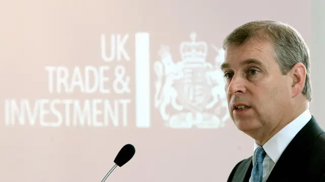 A file photo of Andrew speaking into a microphone