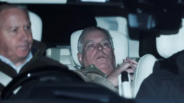 Andrew Mountbatten-Windsor reclined in the back of a car