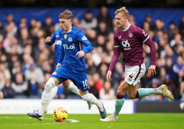 Chelsea's Cole Palmer and Burnley's Joe Worrall during the Premier League match at Stamford Bridg