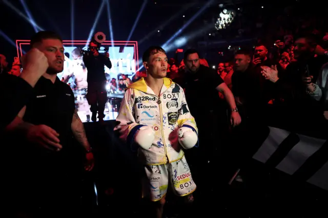 Warrington walks to the ring