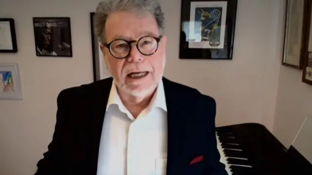 Former US trade negotiator Daniel Mullaney in a suit speaking via video-link to BBC news from his house