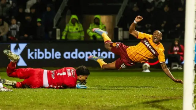 St Mirren's Shamal George pulls down Tawanda Maswanhise