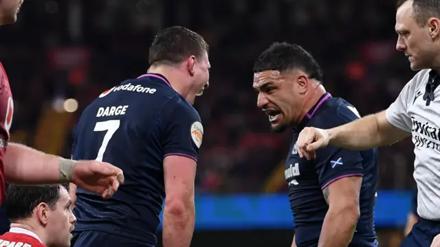 Sione Tuipulotu and Rory Darge of Scotland celebrates after George Turner scores