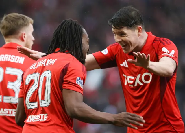 Aberdeen's Kevin Nisbet (R) celebrates with Toyosi Olusanya after scoring to make it 1-0 during a William Hill Premiership match between Aberdeen and Dundee at Pittodrie Stadium, on February 21, 2026, in Aberdeen, Scotland