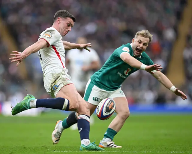 George Ford of England kicks the ball clear whilst under pressure from Craig Casey of Ireland