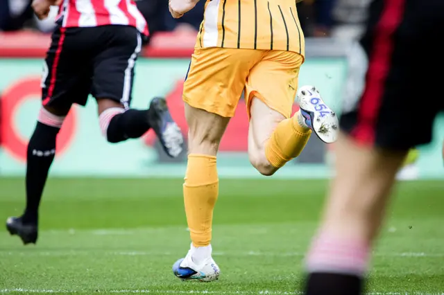 James Milner of Brighton & Hove Albion wears boots in commemoration of his 654th Premier League appearance during the Premier League match between Brentford and Brighton & Hove Albion at Gtech Community Stadium on February 21, 2026 in Brentford, England.