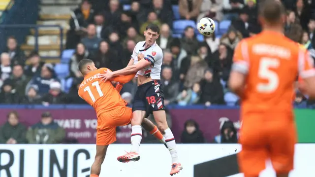 An aerial battle in the game between Bolton and Blackpool