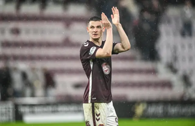 Islam Chesnokov applauds the fans at full time