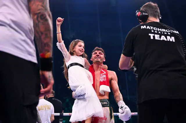 Leigh Wood celebrates with his daughter