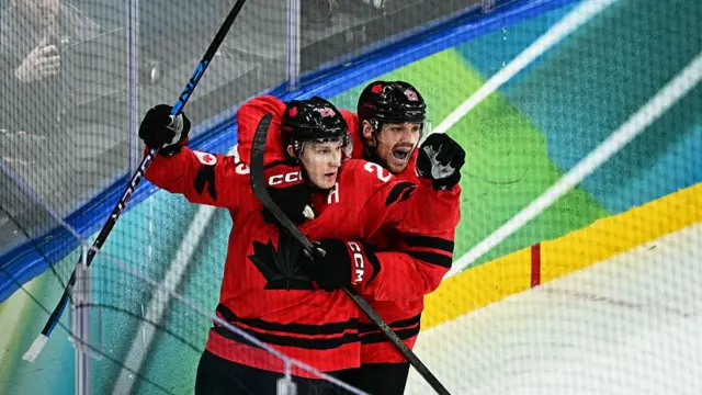 Nathan McKinnon celebrates his game-winning goal against Finland