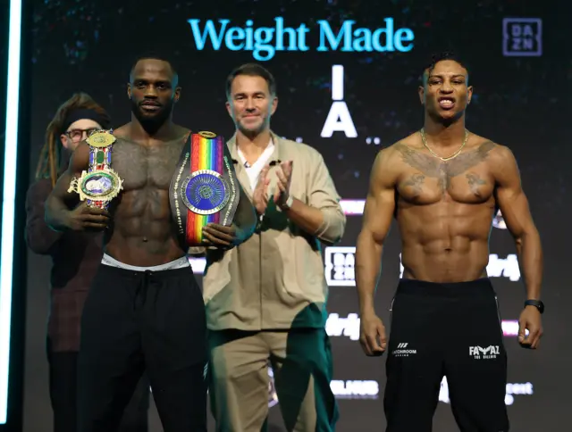 Ishmael Davis holds the  British and Commonwealth super-welterweight titles on his shoulders and stands next to Bilal Fawaz