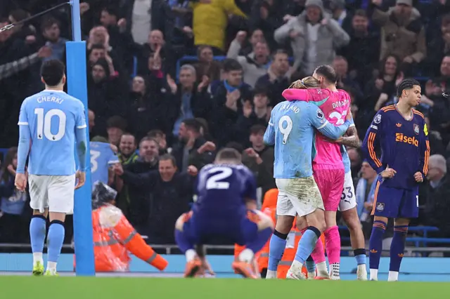 Erling Haaland of Manchester City celebrates with Gianluigi Donnarumma of Manchester City at full time