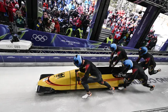 Johannes Lochner and his Germany sled start their opening run